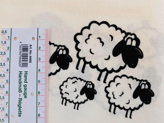 Baumwolle Webware schwarze Schafe auf altweiß weiß